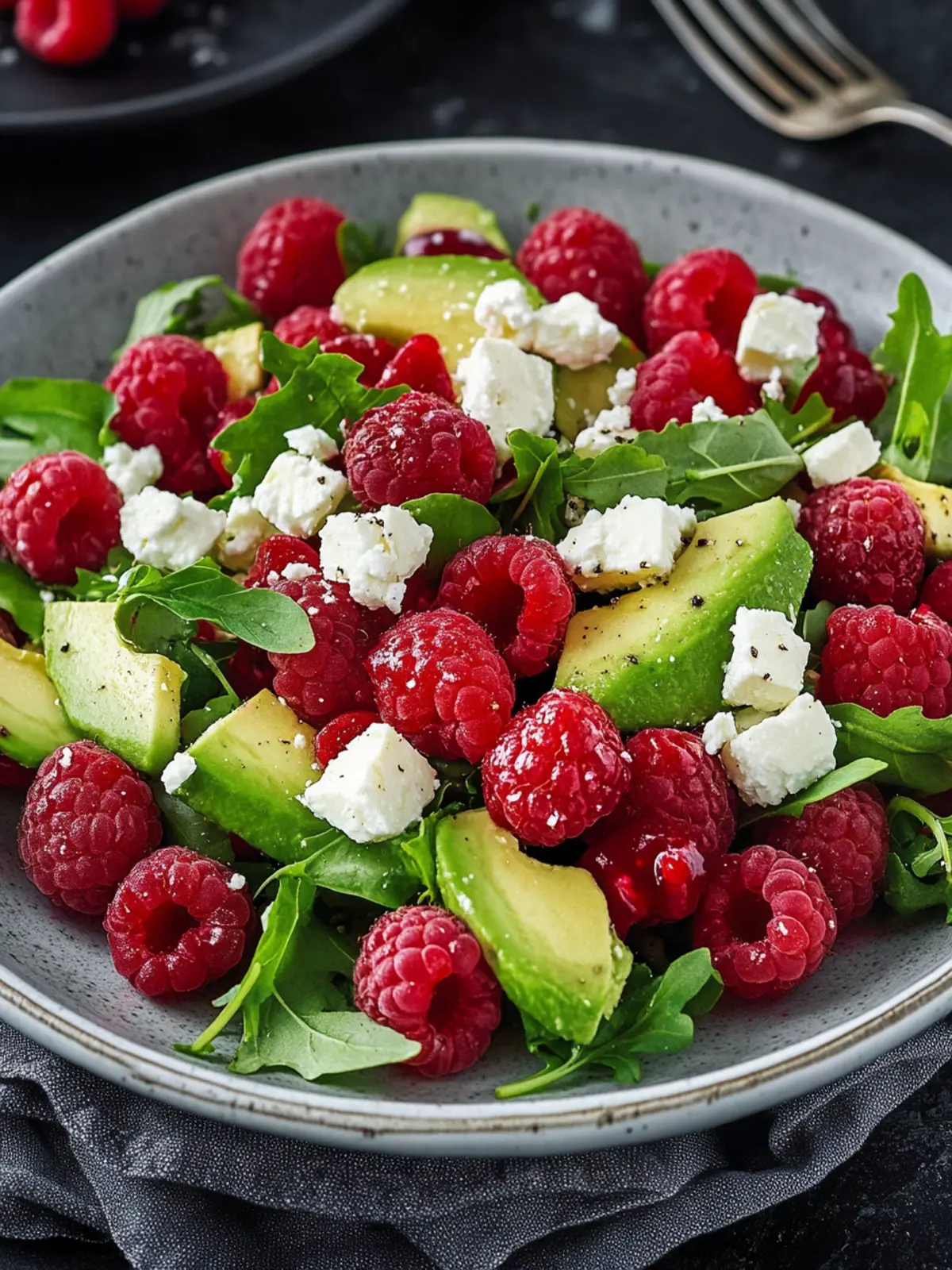 Refreshing summer delight: fruity salad with raspberries, avocado, and feta